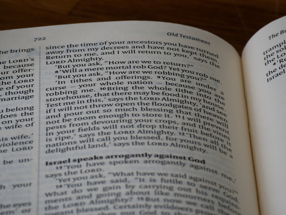 a close up of an open book on a table