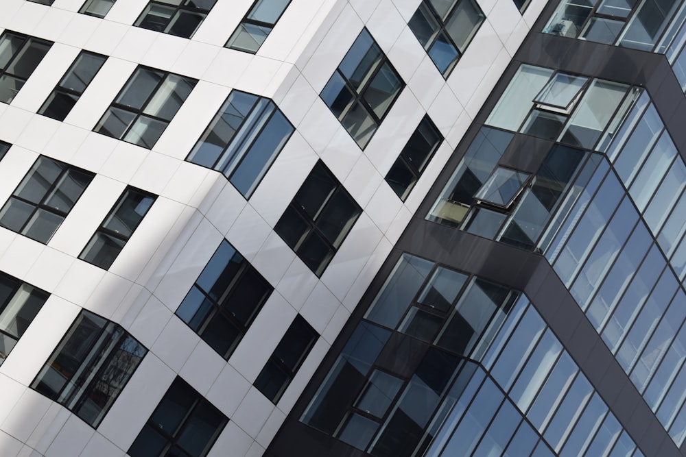 a tall white building with lots of windows