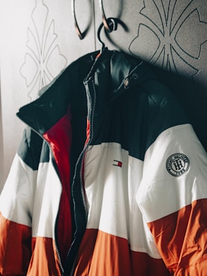 a jacket hanging on a coat rack in a room