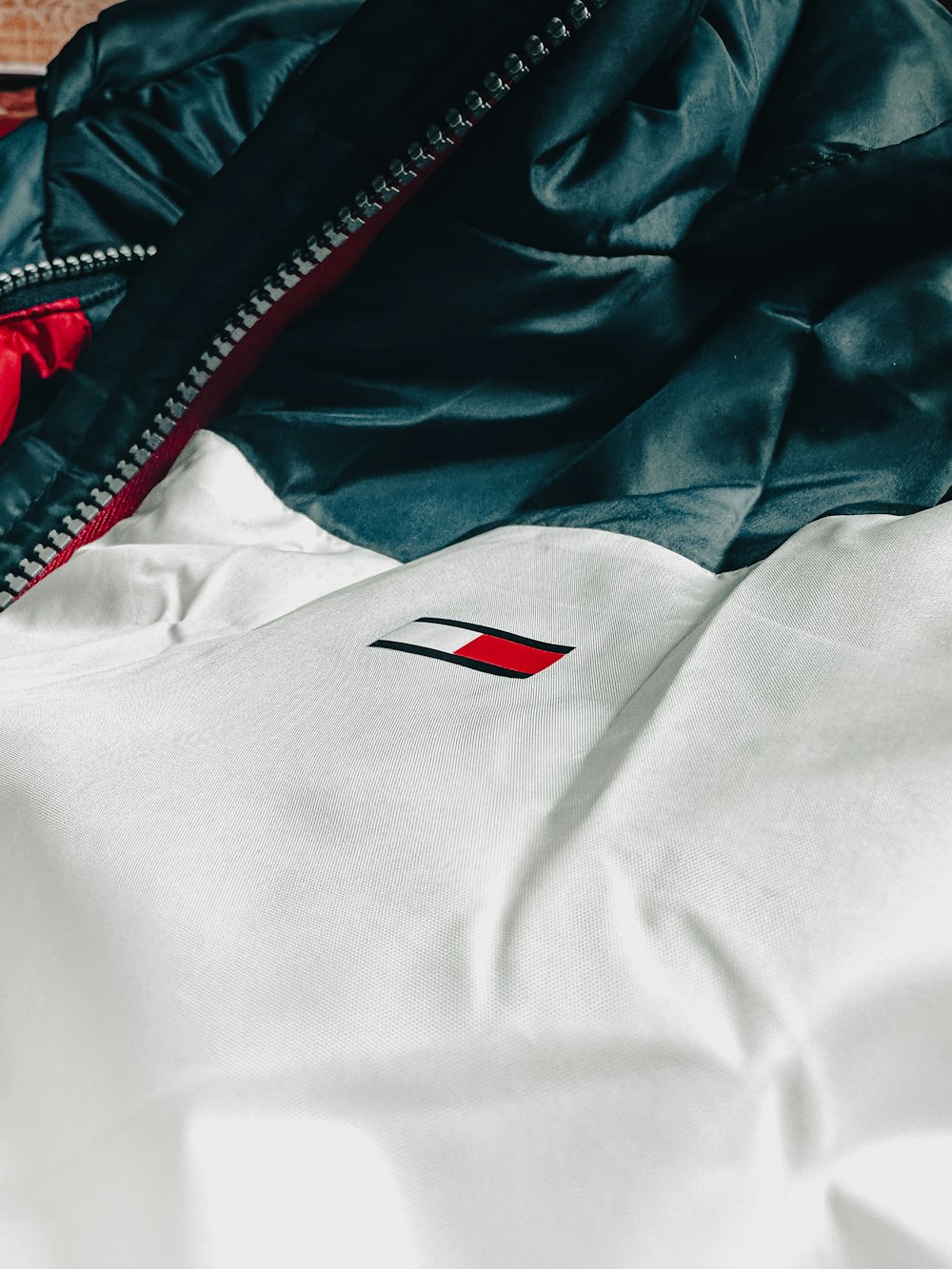 a close up of a jacket on a bed