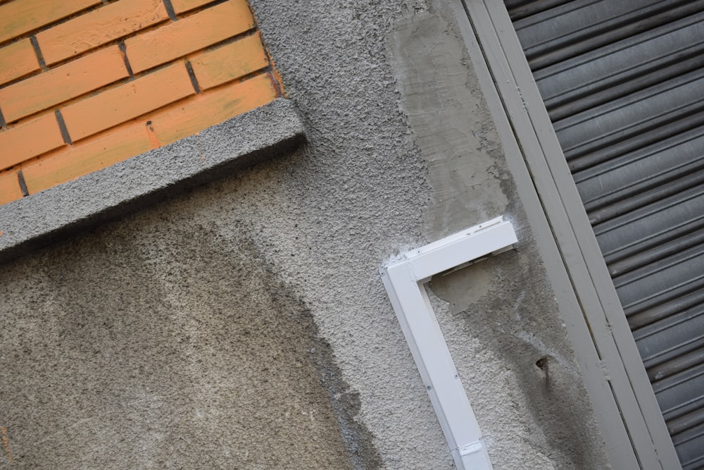 a close up of a street sign on a building