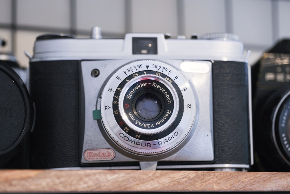 a camera sitting on top of a wooden table