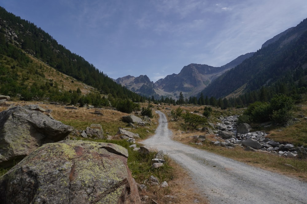 a dirt road in the middle of a mountain range