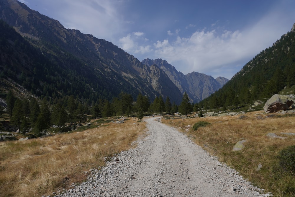 a dirt road in the middle of a mountain range