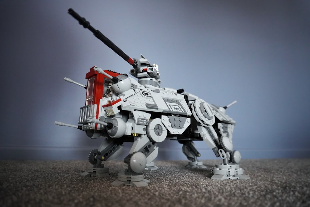 a lego robot that is standing on the ground