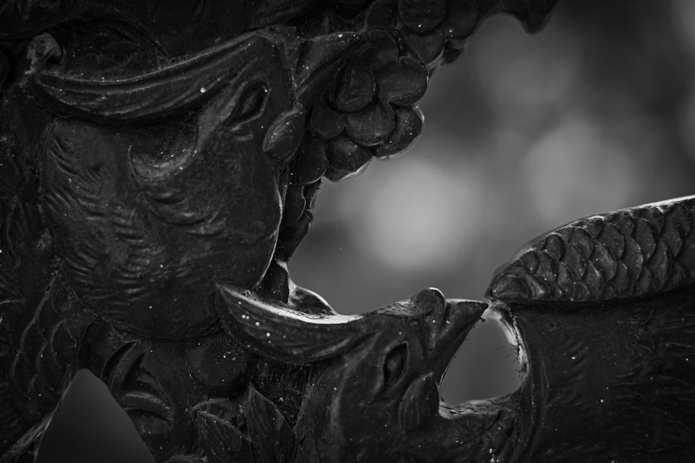 a black and white photo of a statue