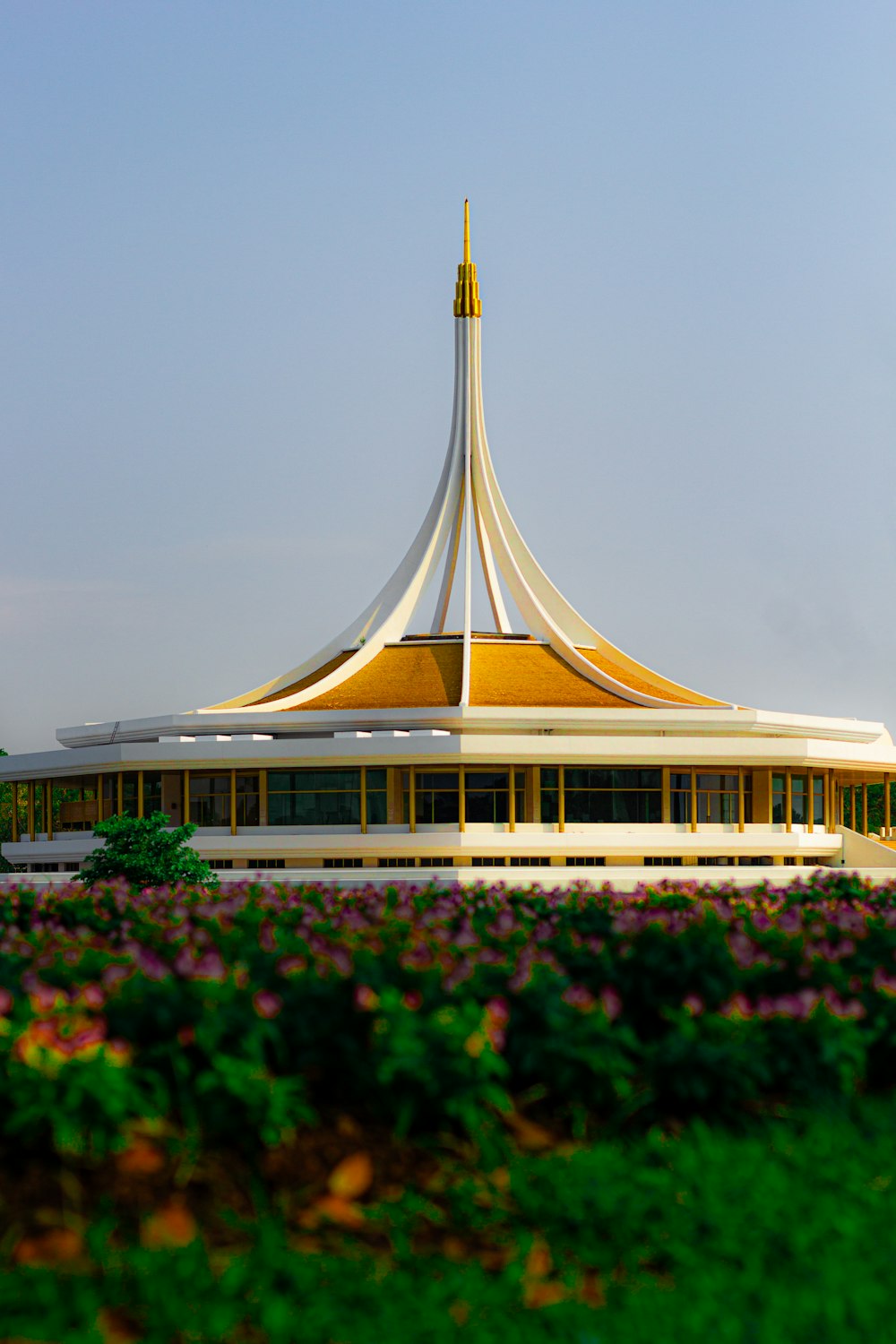 a large white building with a yellow roof