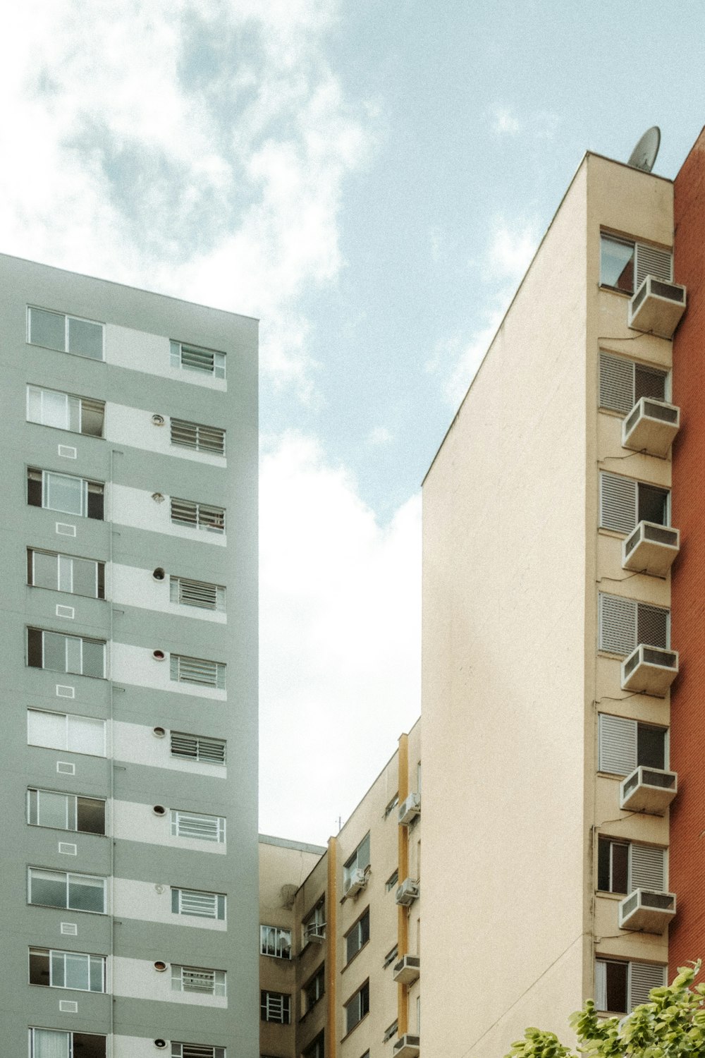 a tall building with balconies and balconies on the windows