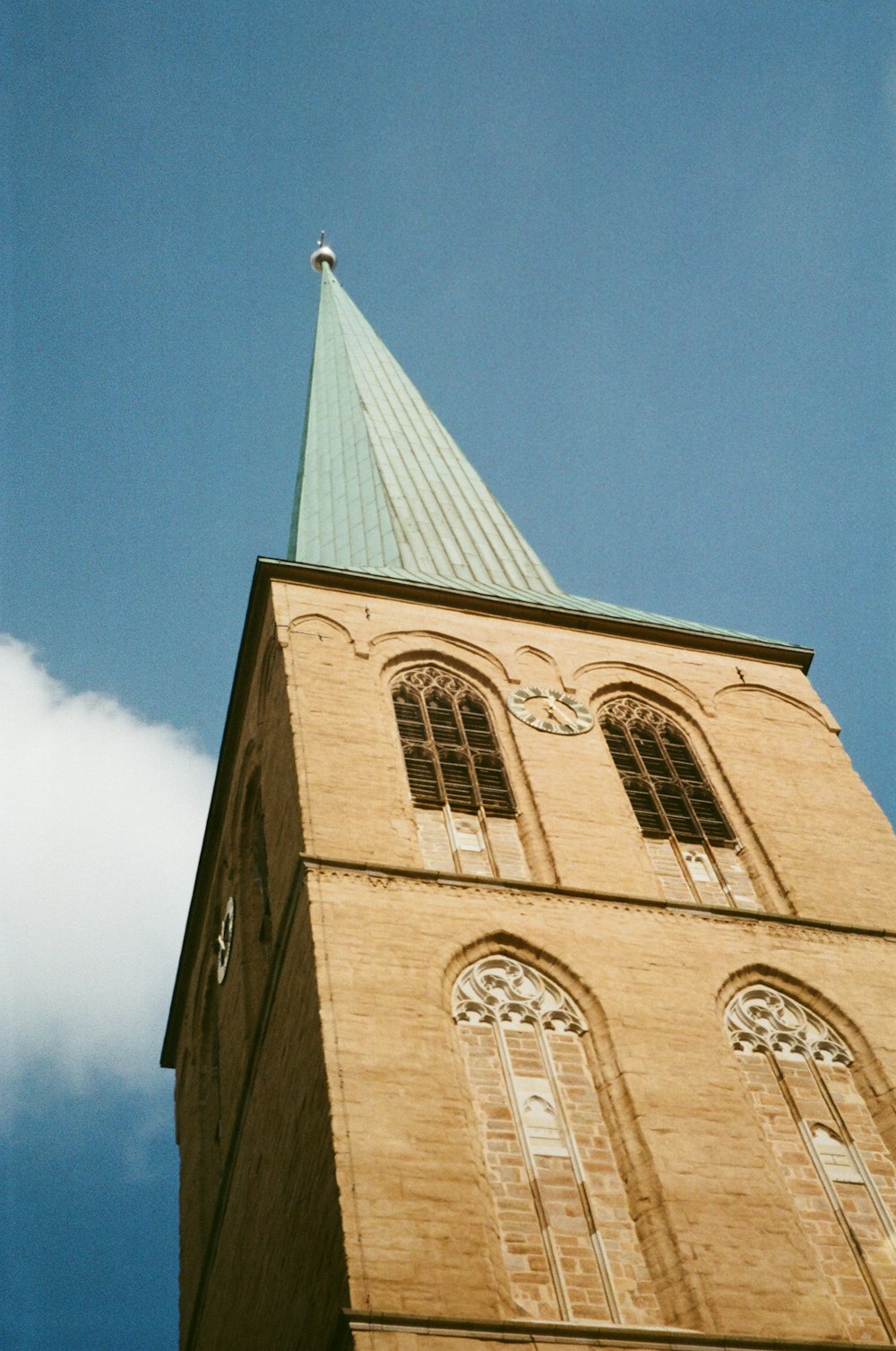 a tall tower with a clock on the top of it