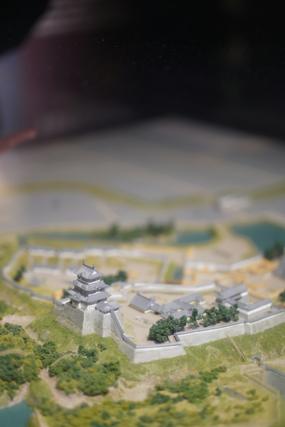 a model of a palace with a lot of trees