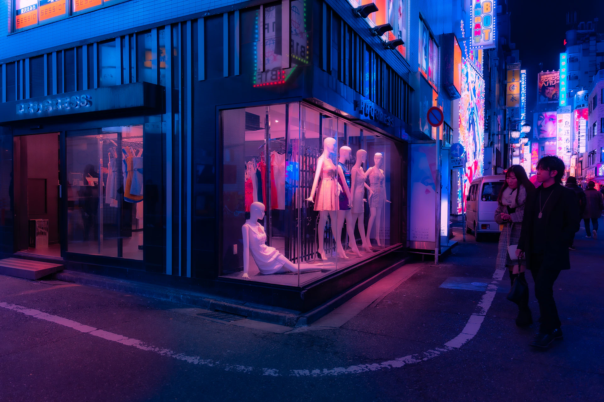 a group of people walking down a street next to a tall building