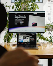 a person sitting in front of a computer screen