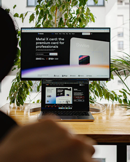 a person sitting in front of a computer screen