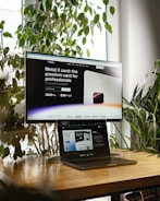 a desktop computer sitting on top of a wooden desk