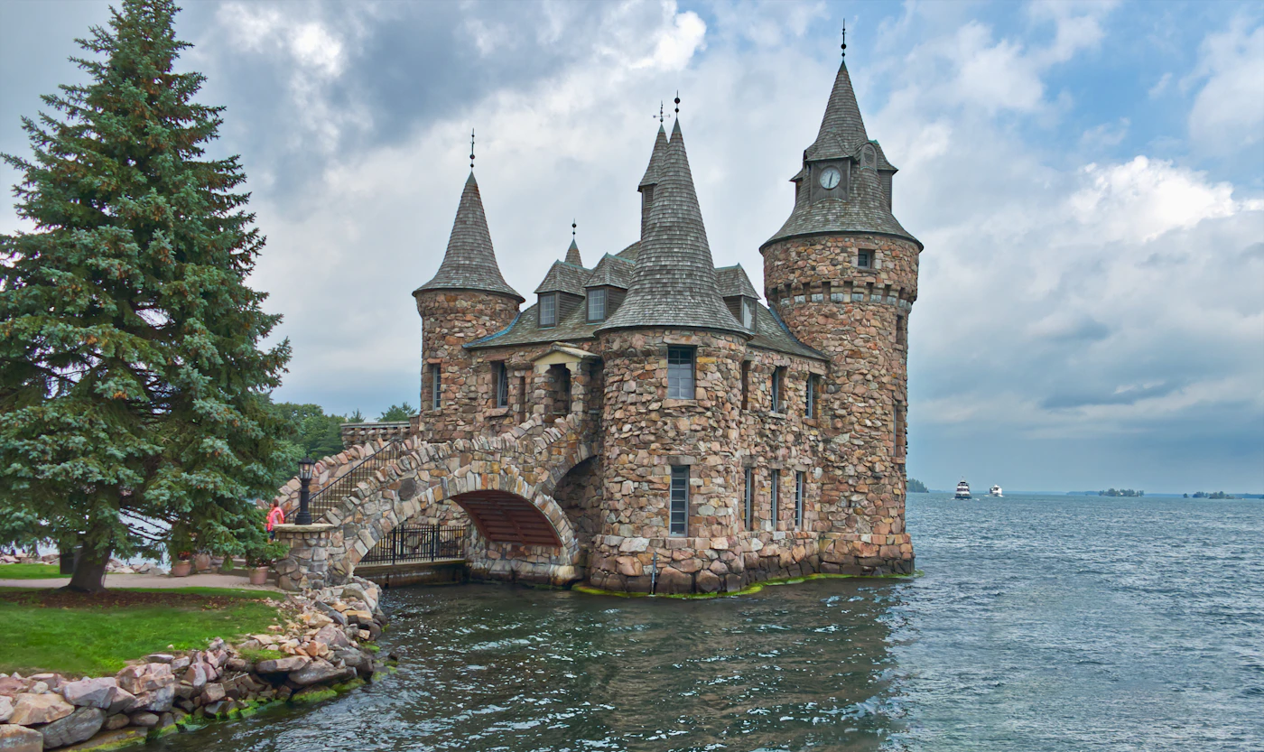 Boldt Castle on Heart Island in the Thousand Islands, a stone castle surrounded by the St. Lawrence River with forested islands in the background