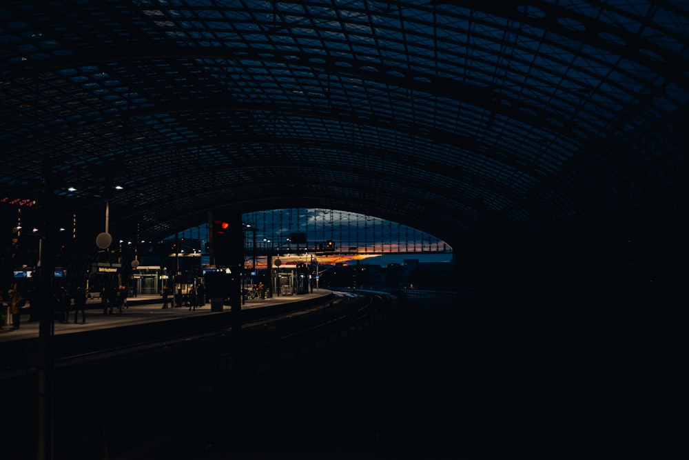 a train station with a train on the tracks