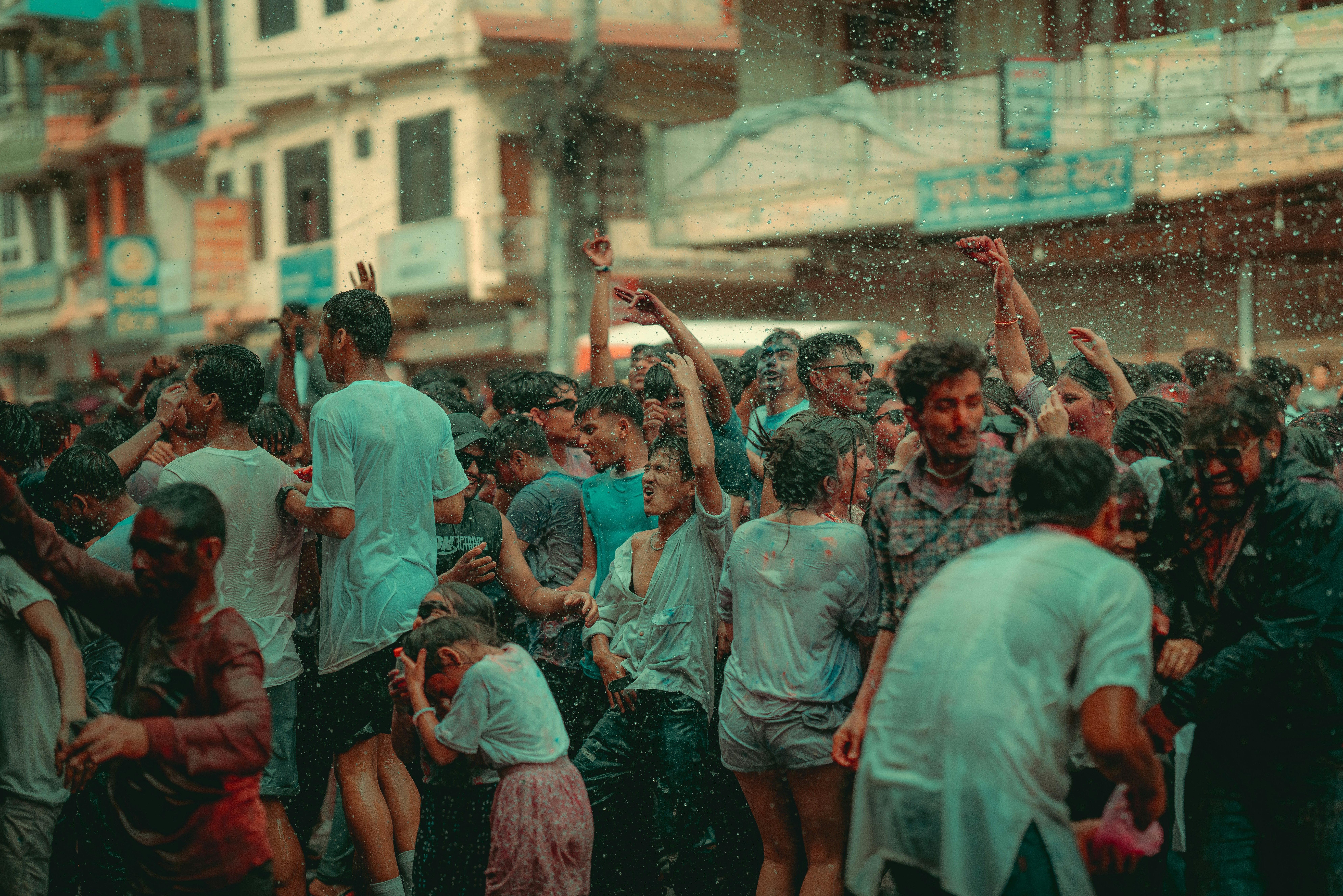 a crowd of people standing around each other