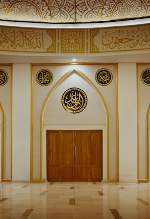a large room with a wooden door and two round windows