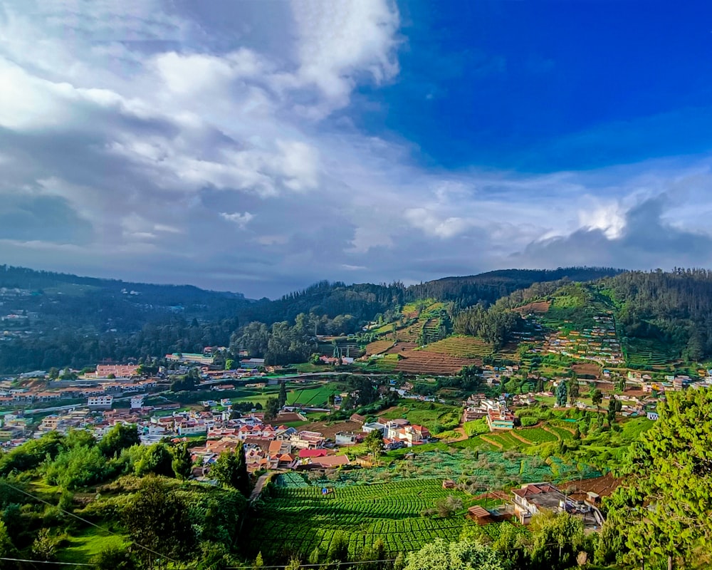 a scenic view of a small town on a hill