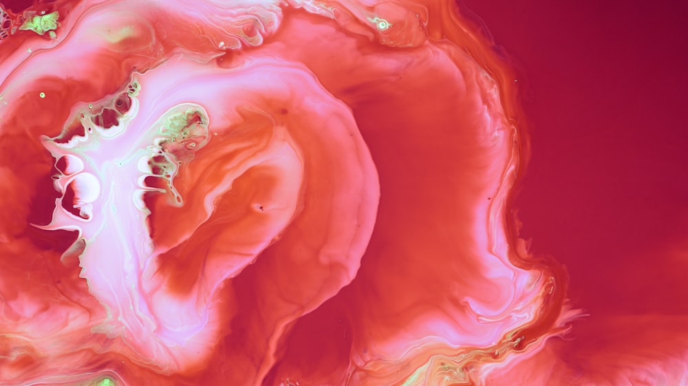 a close up of a red and pink substance