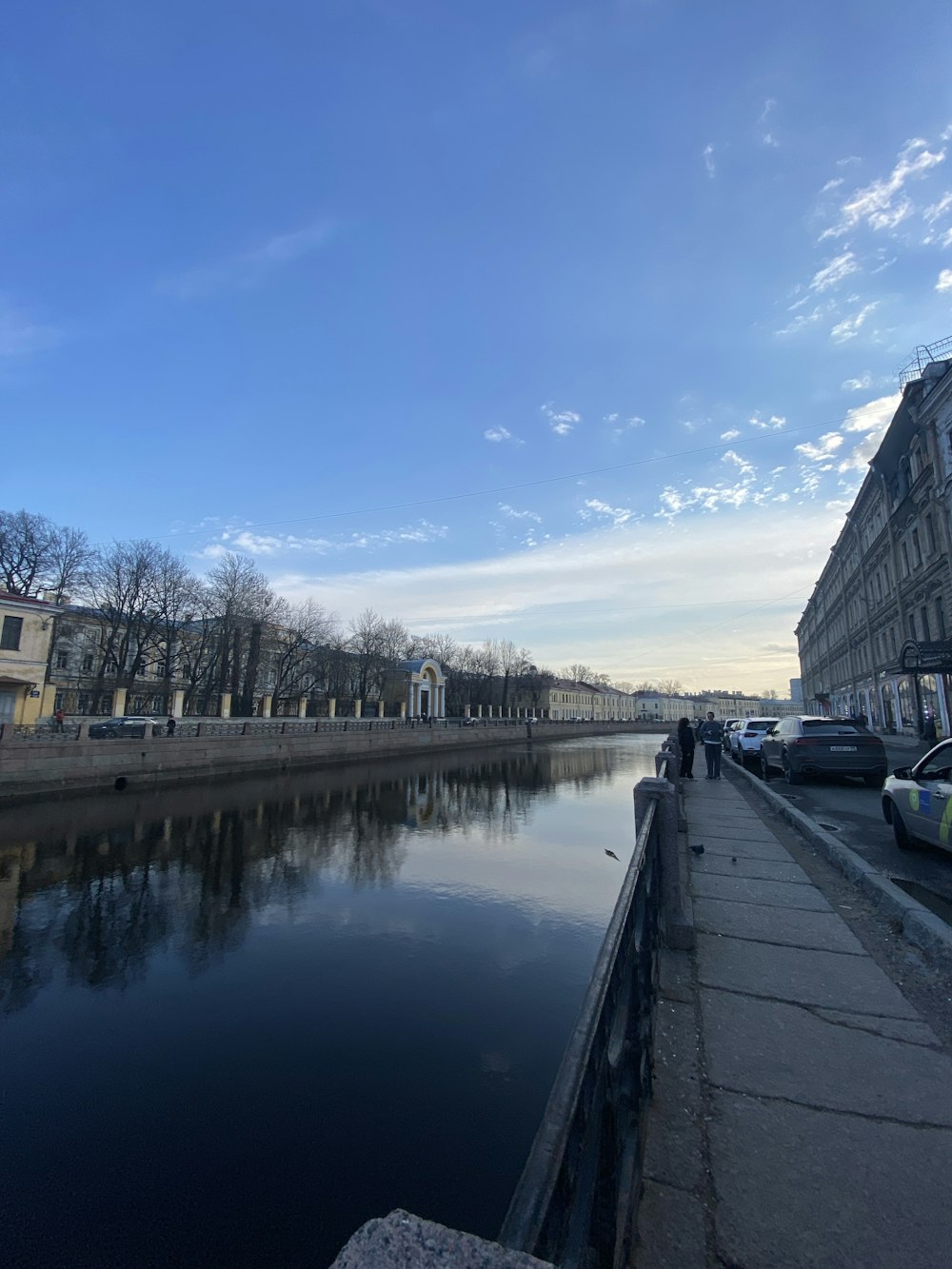 a body of water next to a street