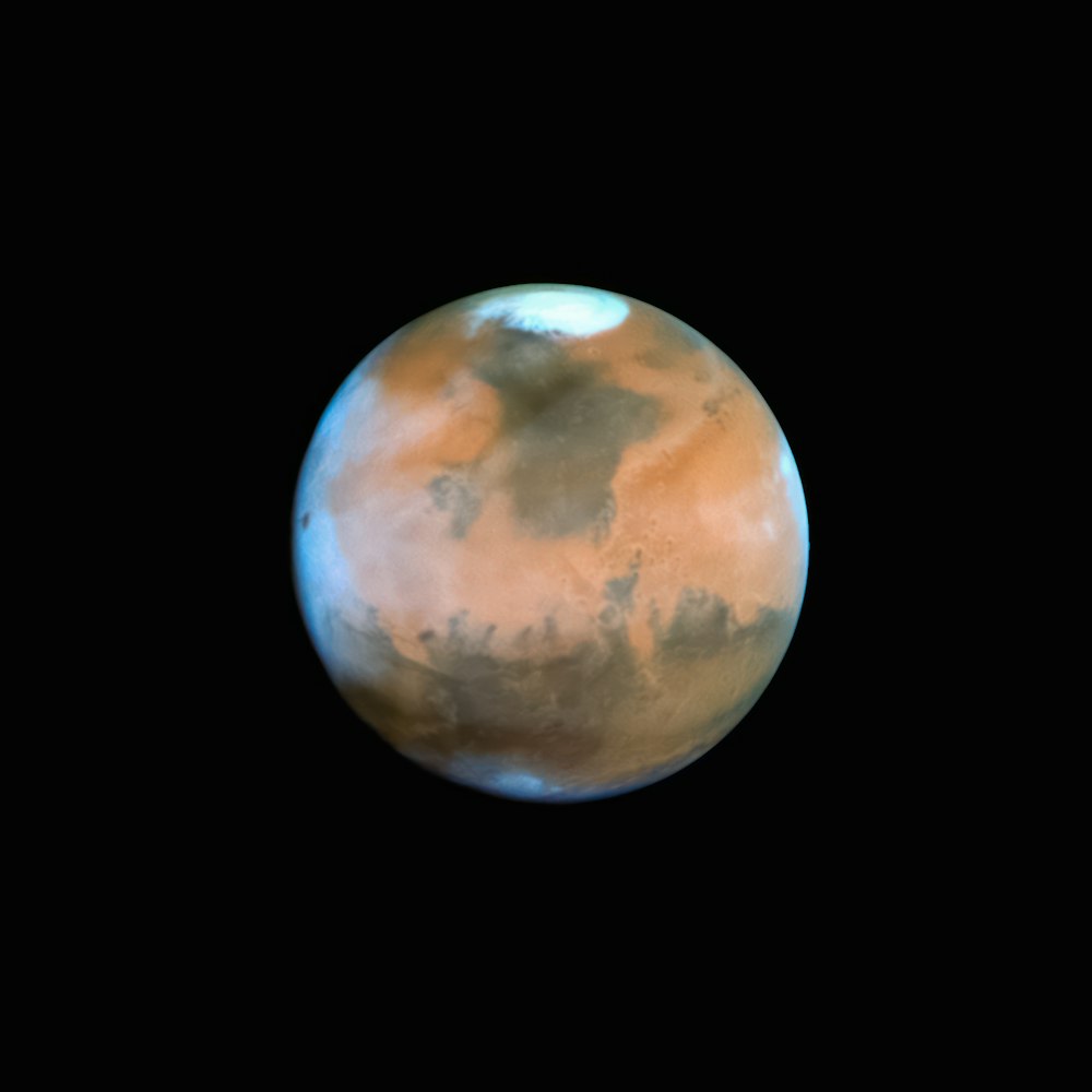 a red planet with a black background