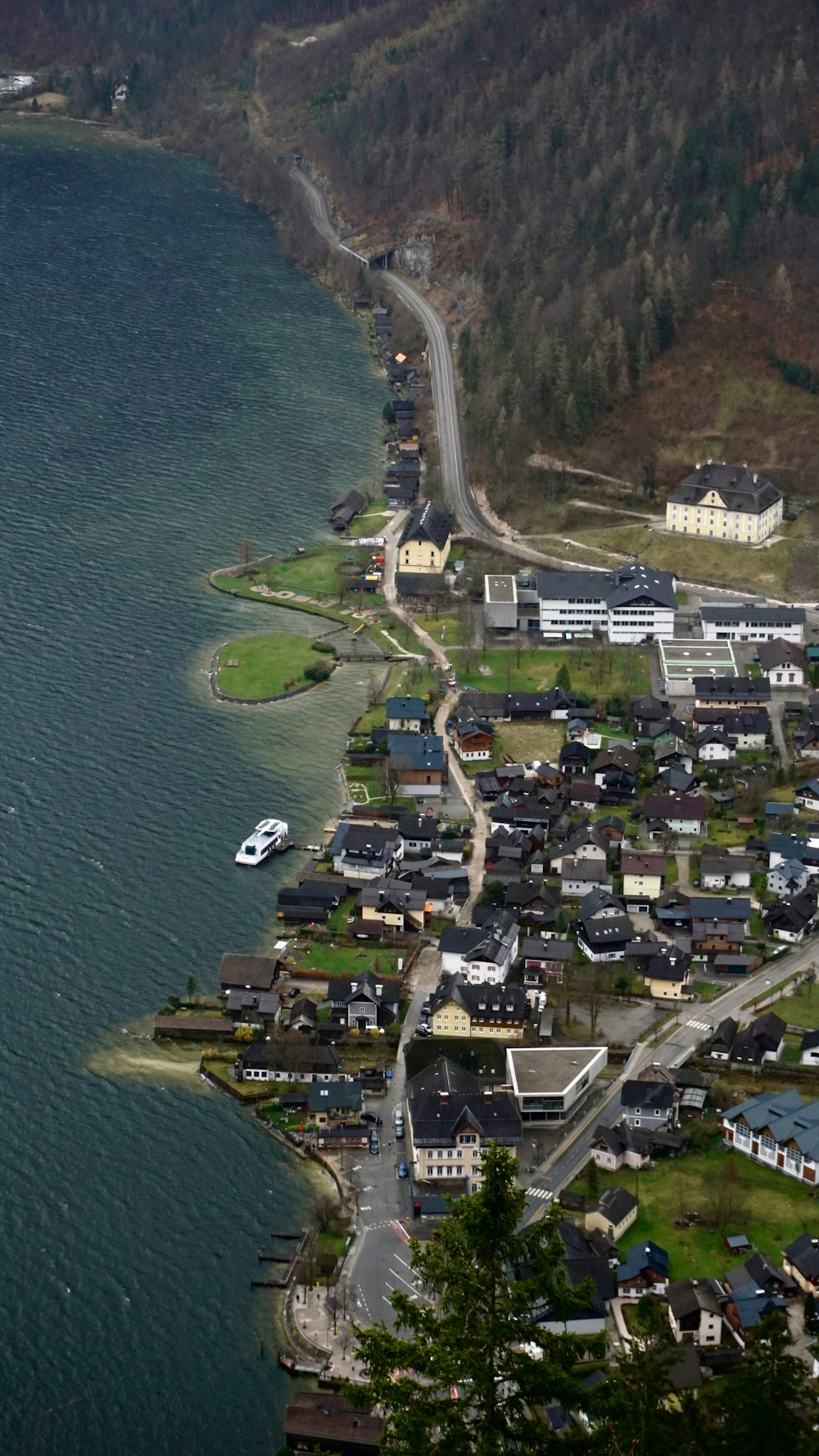 an aerial view of a town by the water