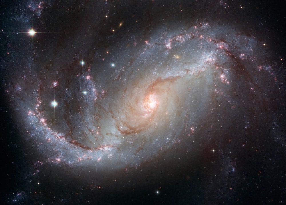 a very large spiral galaxy with stars in the background