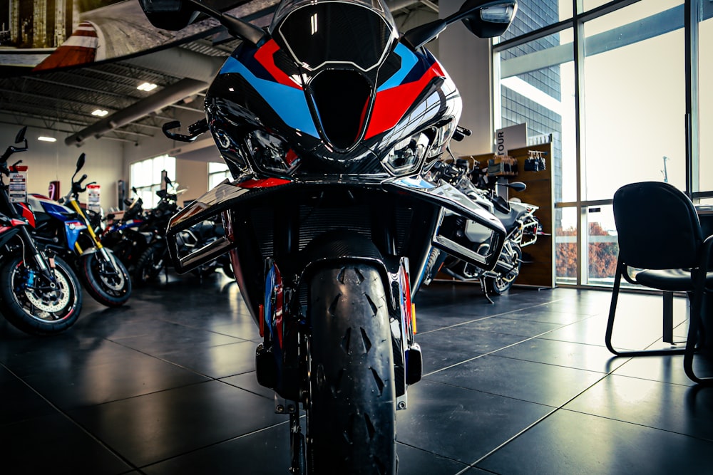 a group of motorcycles parked inside of a building