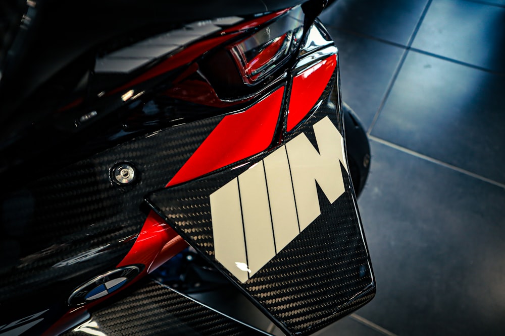 a close up of a red and black motorcycle
