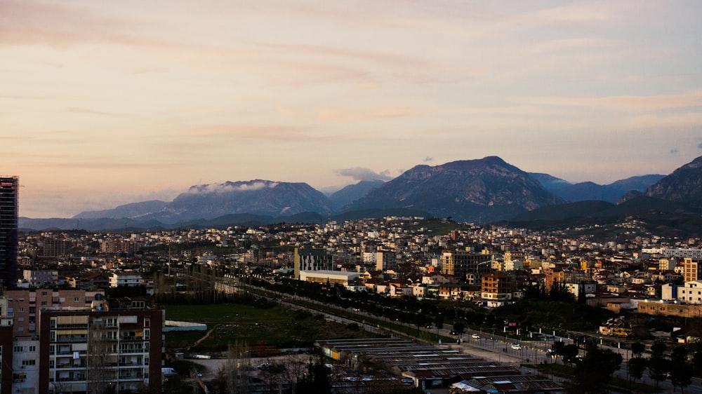 a view of a city with mountains in the background