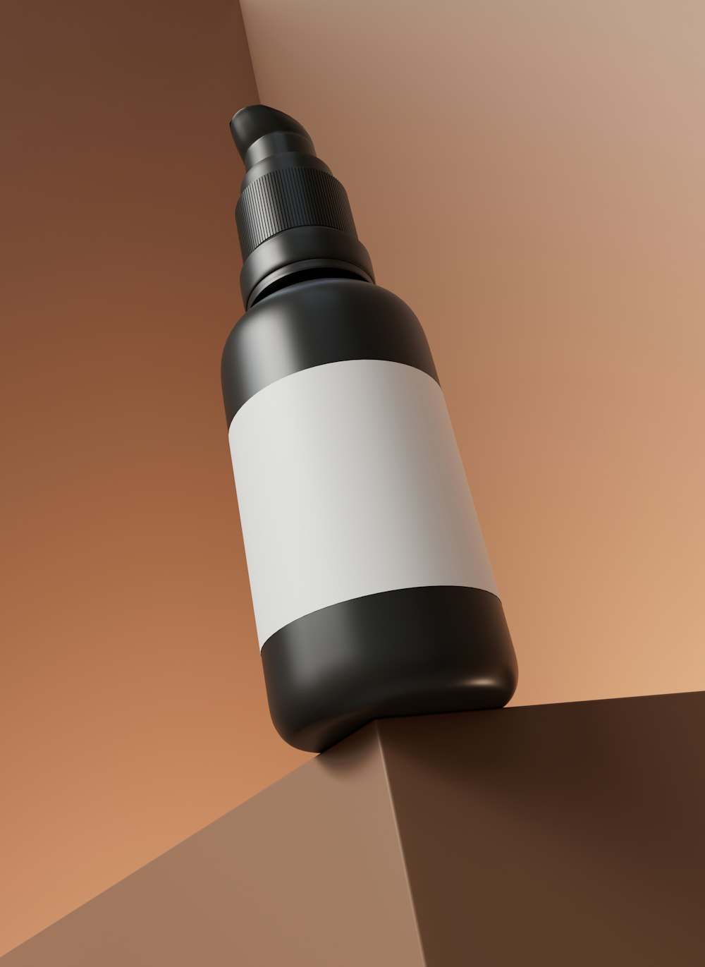 a black and white bottle sitting on top of a wall