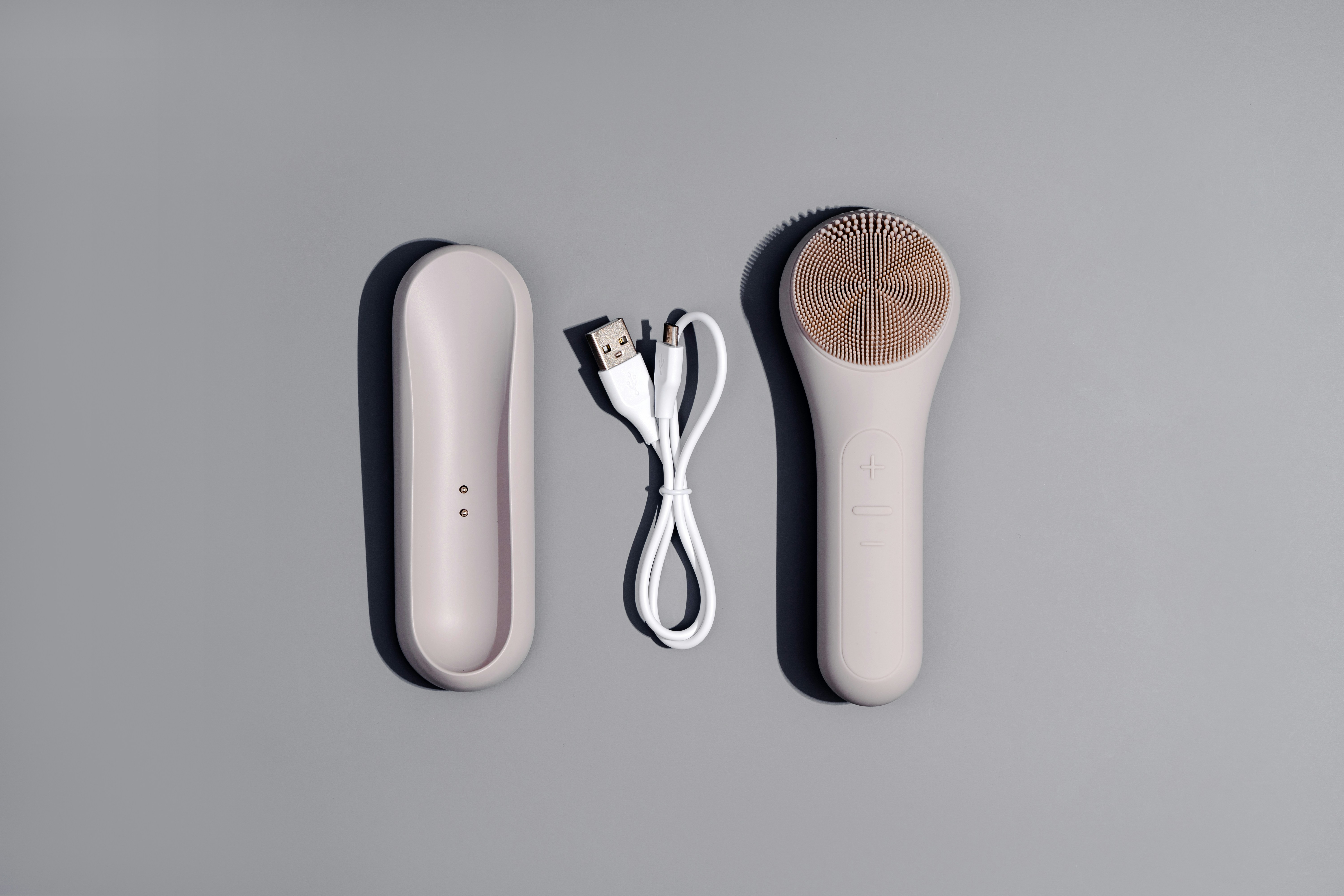 A collection of beauty tech devices arranged on a vanity