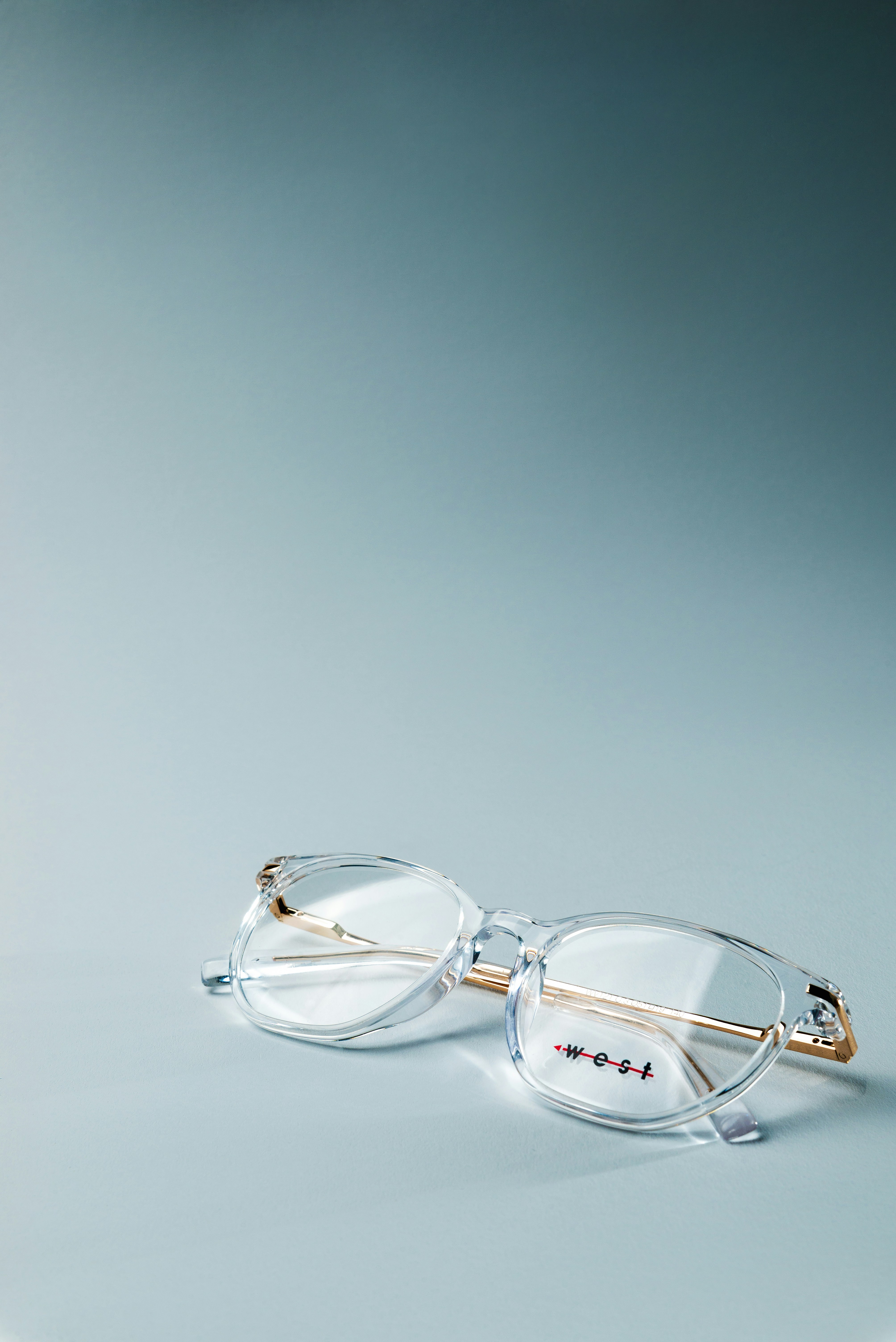 a pair of glasses sitting on top of a table