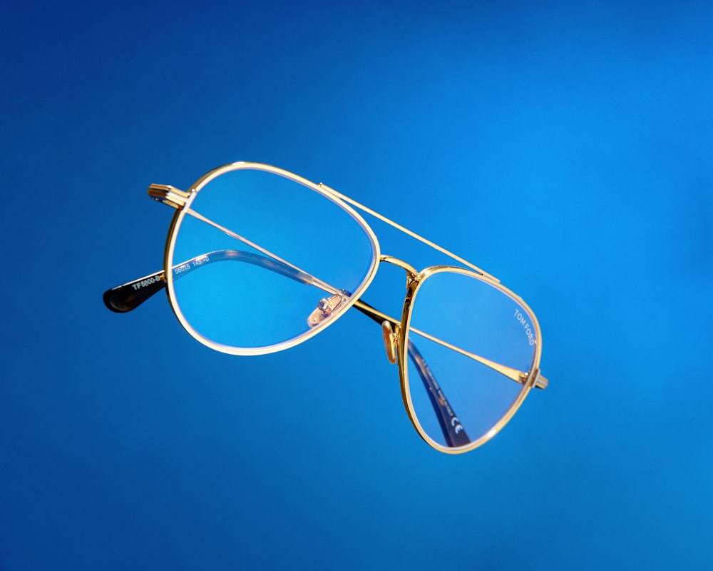 a pair of glasses against a blue sky