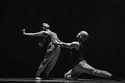 a male and a female dancer performing on stage