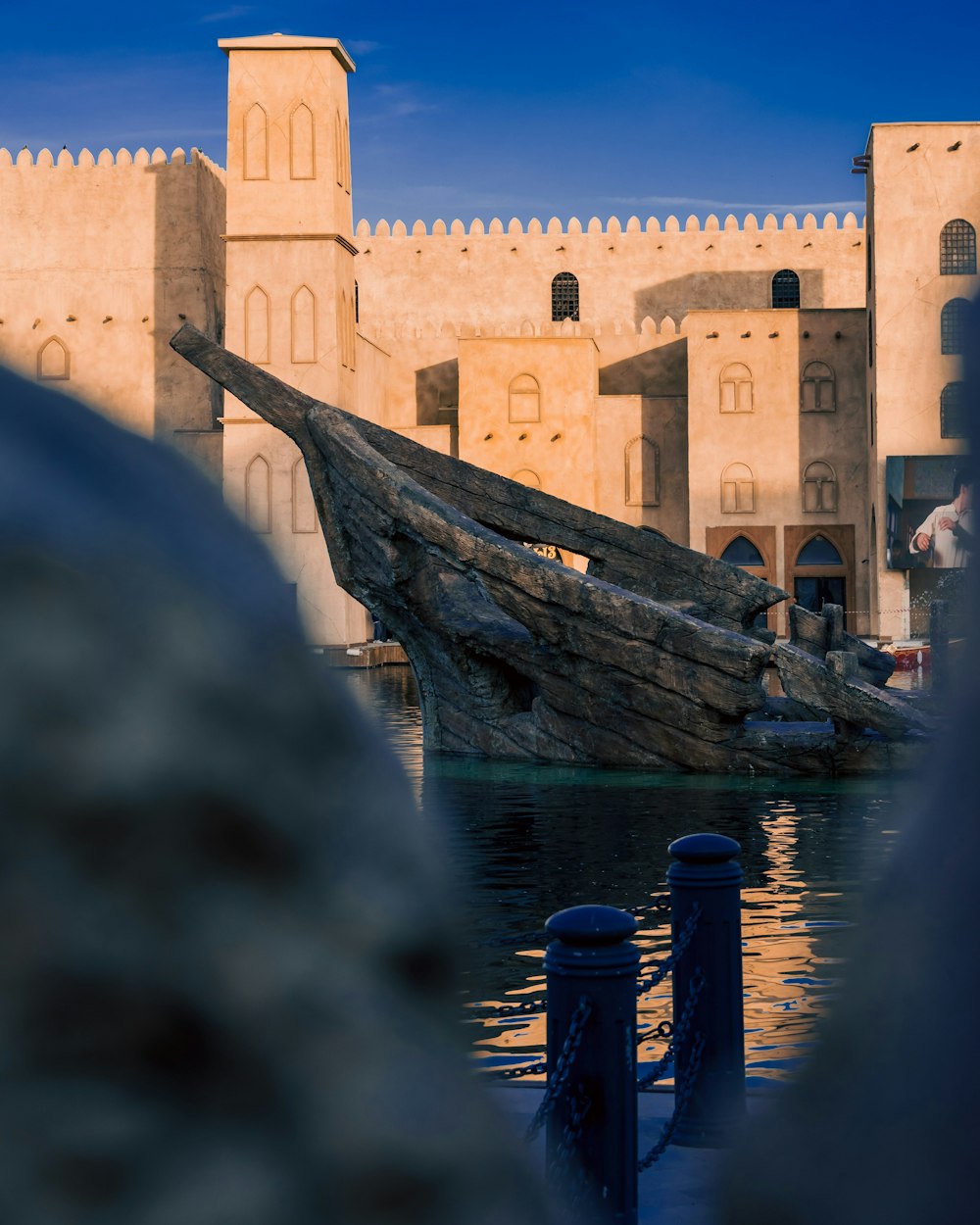 a boat sitting on top of a body of water