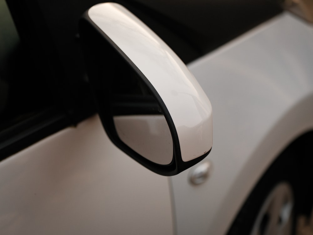 a close up of a car's side view mirror