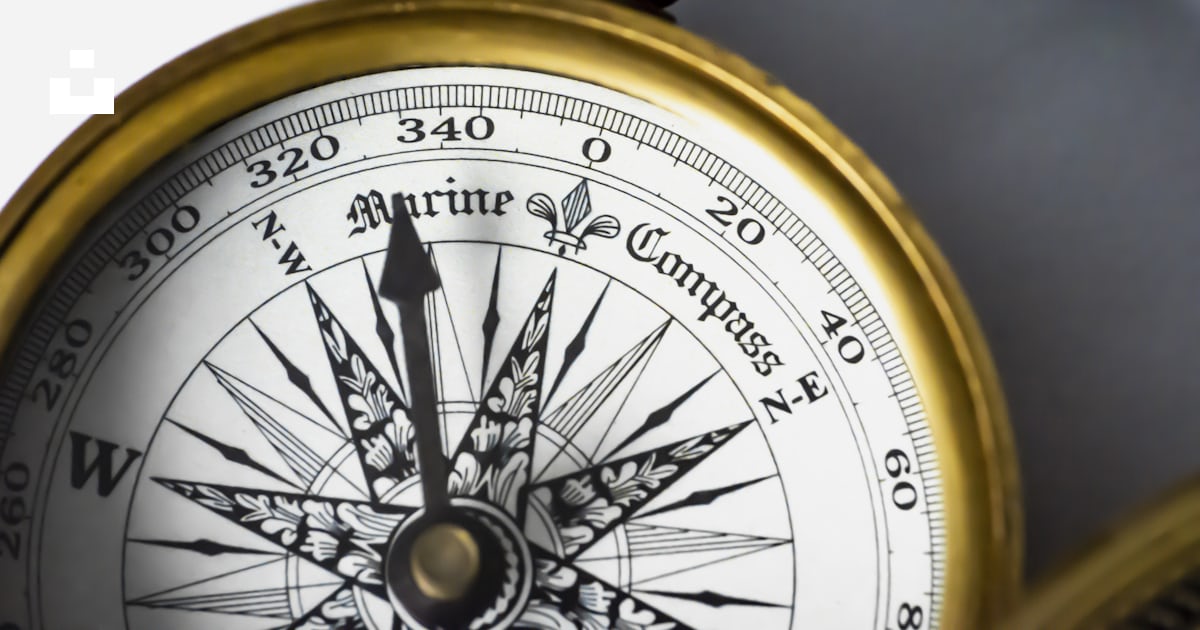 A close up of a compass on a white background photo – Free Compass ...