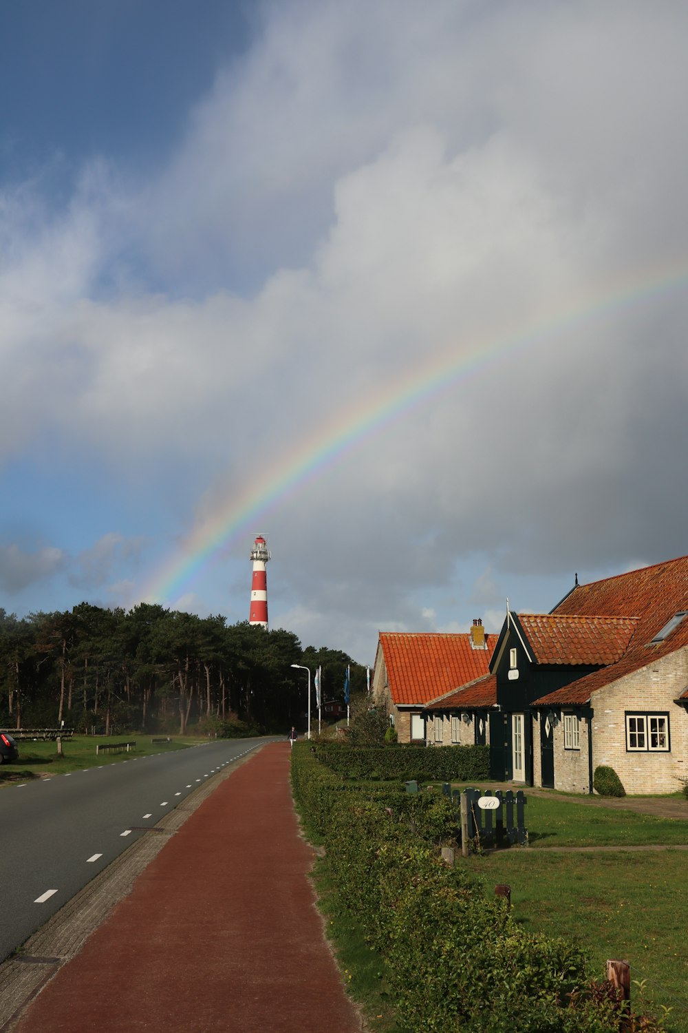 a house with a rainbow in the background