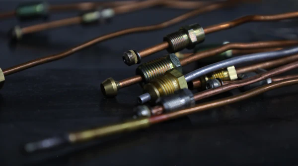 Copper refrigerant line fittings up close