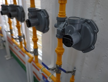 a group of pipes connected to a wall