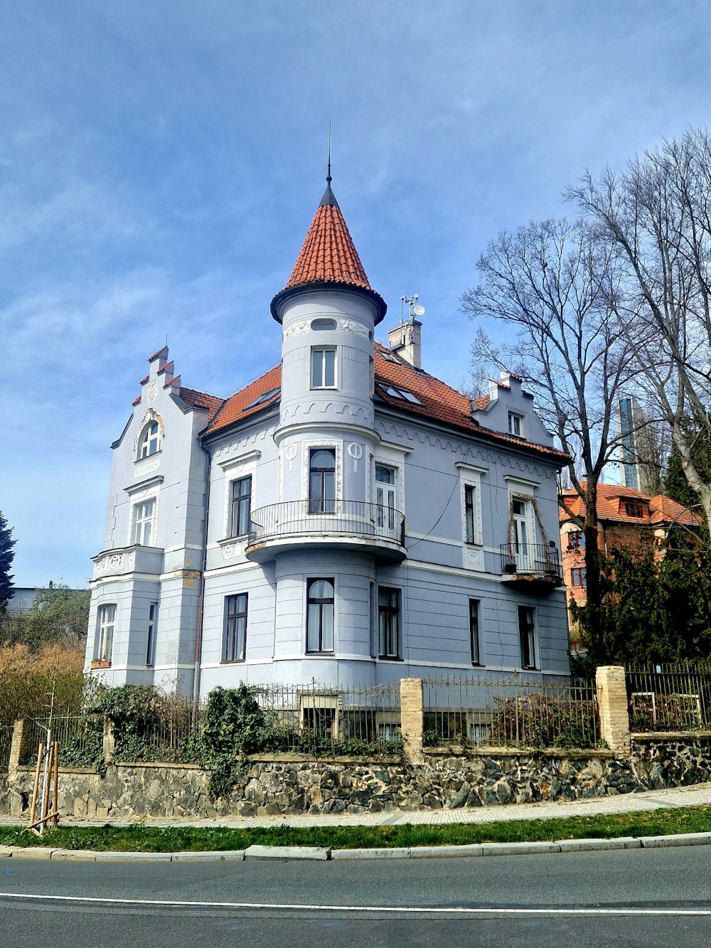 a large white building with a red roof