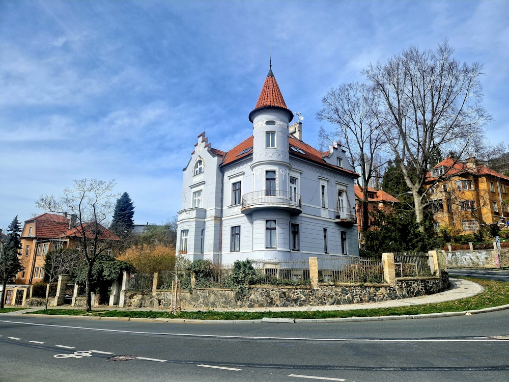 a large white building with a red roof