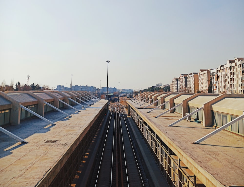 a train station with a train on the tracks