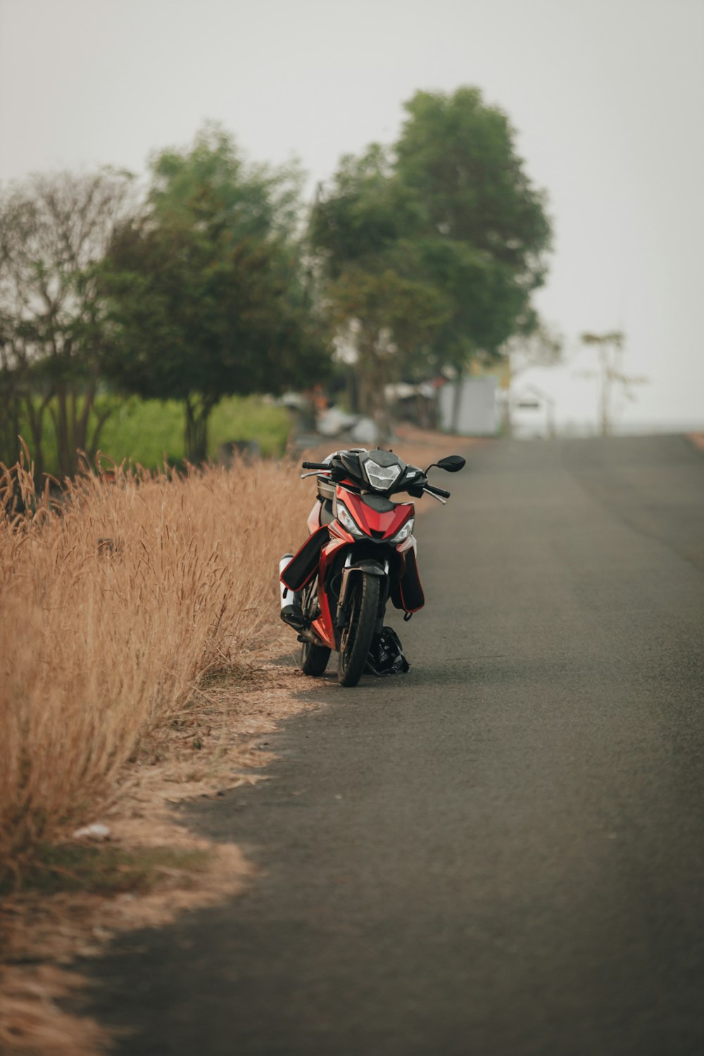 a motorcycle parked on the side of the road