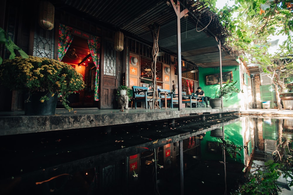 a house with a pond in front of it