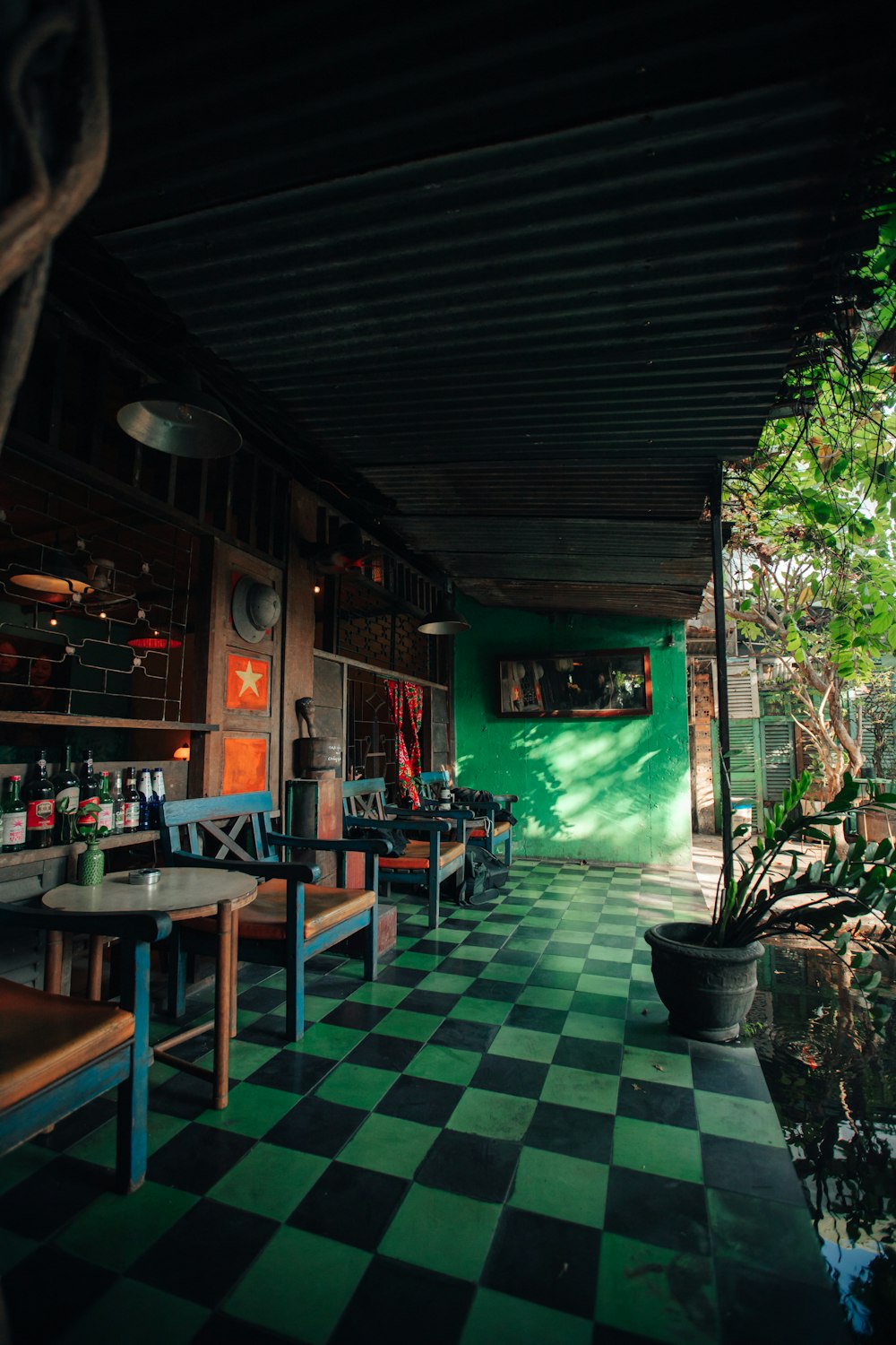 a restaurant with a checkered floor and green walls