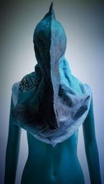a mannequin's torso with a towel wrapped around it