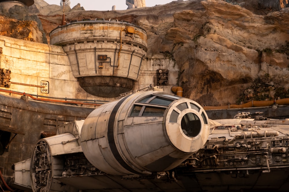 a star wars vehicle is parked in front of a mountain
